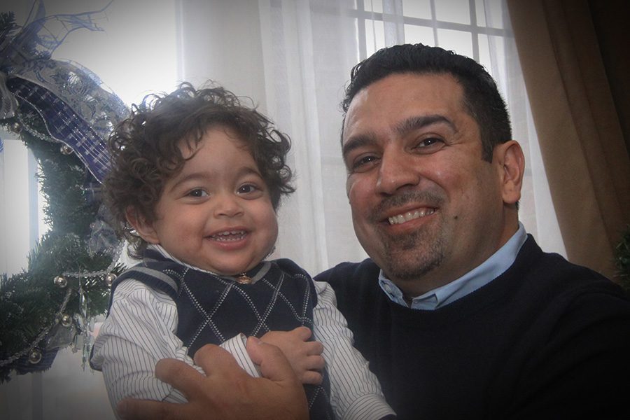 Recipient Efrain Maldanado embraced by man