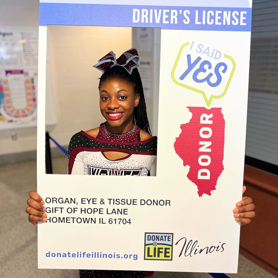 Cheerleader holding license frame