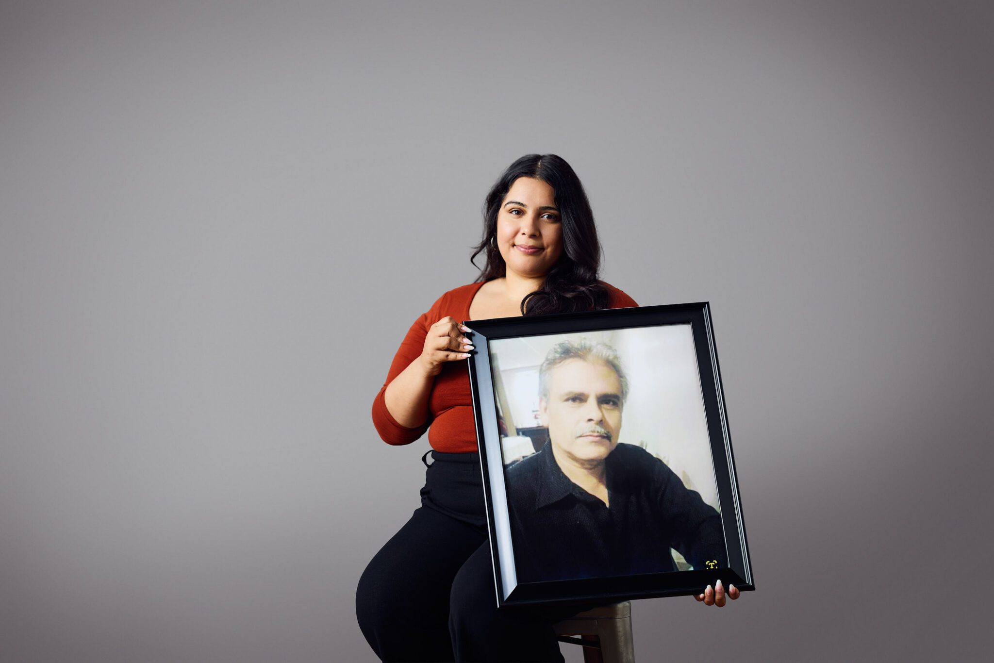 Jeanette holding picture of dad