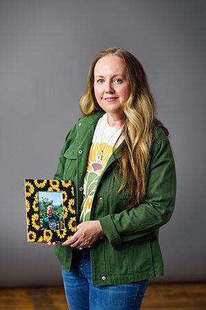 Melissa holding a picture of Elijah